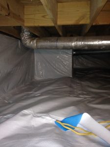 Previously damp crawlspace fully encapsulated in waterproof material